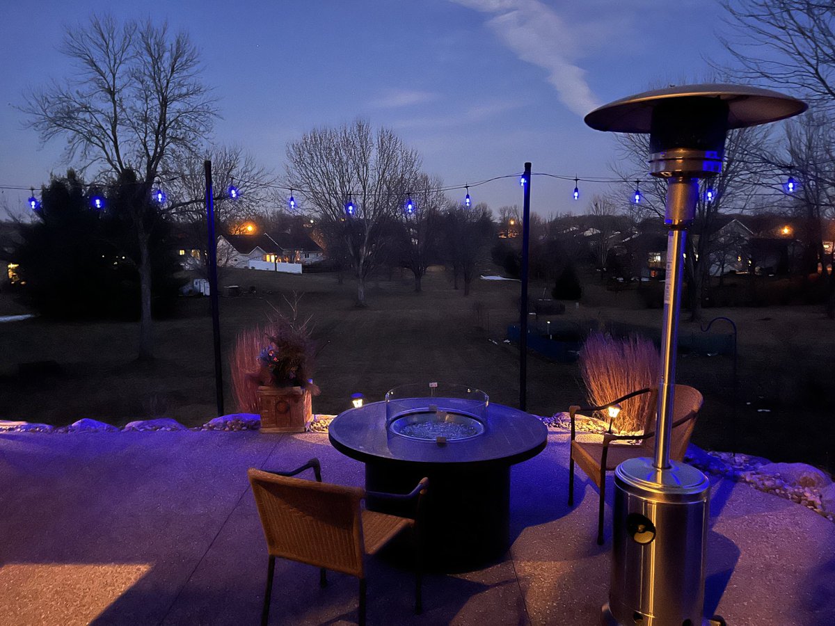 Blue lights in front of and back of our house proudly.