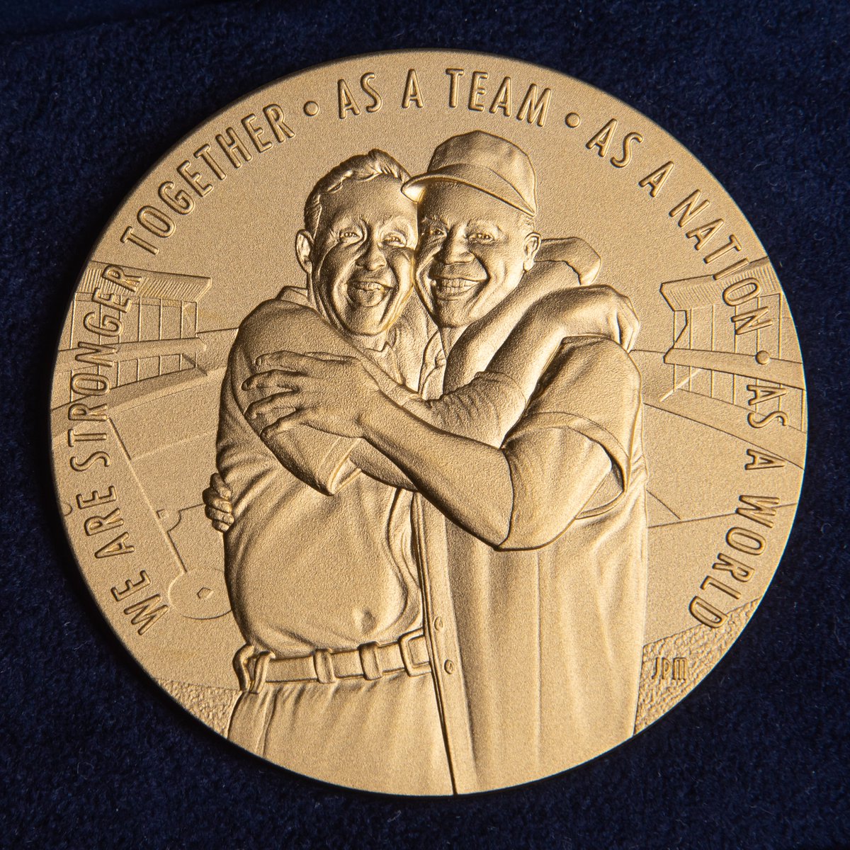 castrovince's tweet photo. The photo of a Black man and a white man celebrating a World Series victory went all over the world.

Now, it is etched in gold, and two families are forever intertwined.

@MLBNetwork @MLB @usmint 

Story 📰: https://t.co/qxi7mrqz1E

Video 📺: https://t.co/nKaVUqDsAr https://t.co/GuQ1Tmj1Xe