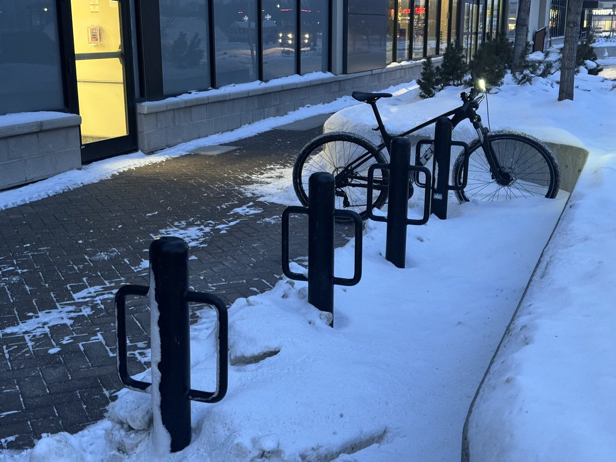 WpgBikeRacks's tweet photo. Wpg Bike Rack #081: Mark's, Polo Park. 

I visited these racks in January. Figured there would still be plenty of snow in February and you all wouldn't notice. 

Deep down, I hope there might be a lil bit of snow left, nestled quietly amongst the strip mall bike racks. https://t.co/DrAoQboojQ