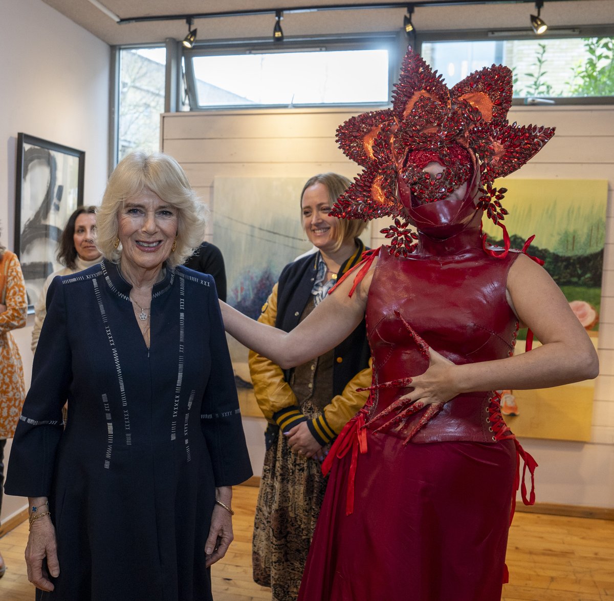 Her Majesty The Queen looks at painting of Princess Charlotte and met Syban Velaidi- Lauder when she visited Kindred Studios’ Shepherds Bush pop-up hub, an art studios and creative space encouraging arts, crafts and community cohesion.