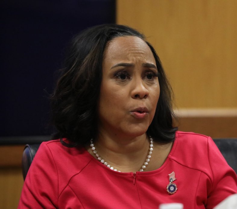 EndWokeness's tweet image. Fani Willis wore her dress backwards and her American flag pin sideways.