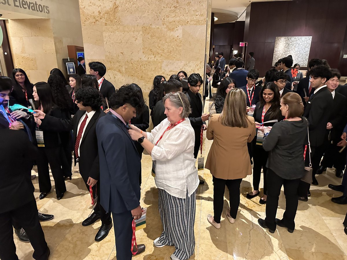trthompson68's tweet photo. Those small things teacher do. That can make such a difference Centennial HS Mrs. Jones helping out before #texasdeca state opening session in Houston. #titannation #cen10titans #cen10deca #friscoisd #texasdeca #deca https://t.co/TTqwKdczNI