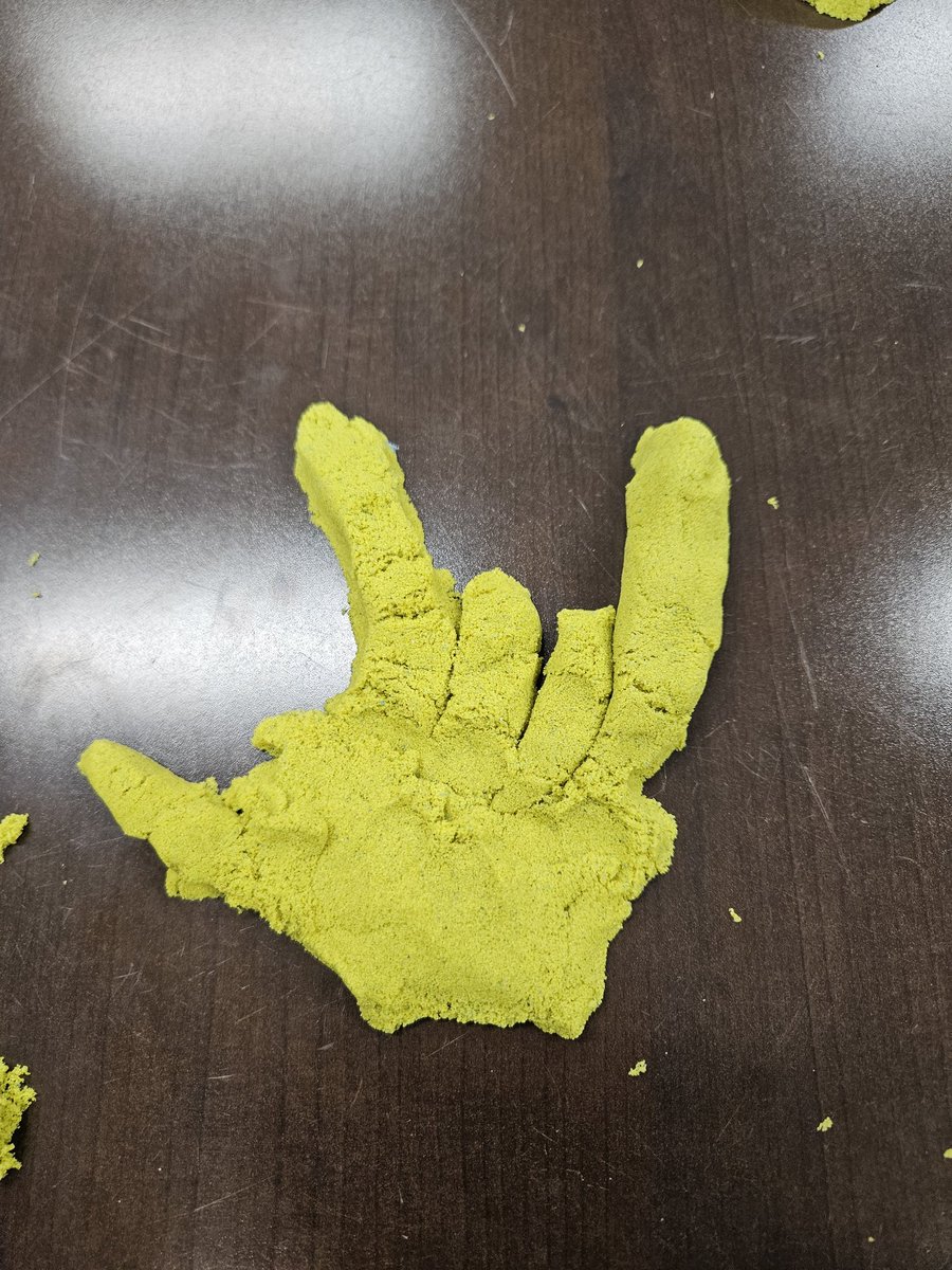 One of my sweet Bindis made our hand signal out of kinetic sand while taking a break with a counselor. Our Bengals have the BESt support system with Dr. Flores, @PwFlores and Mrs. Akerson, @julie_akerson, on campus. #bengalpride #isibindi #houseofcourage