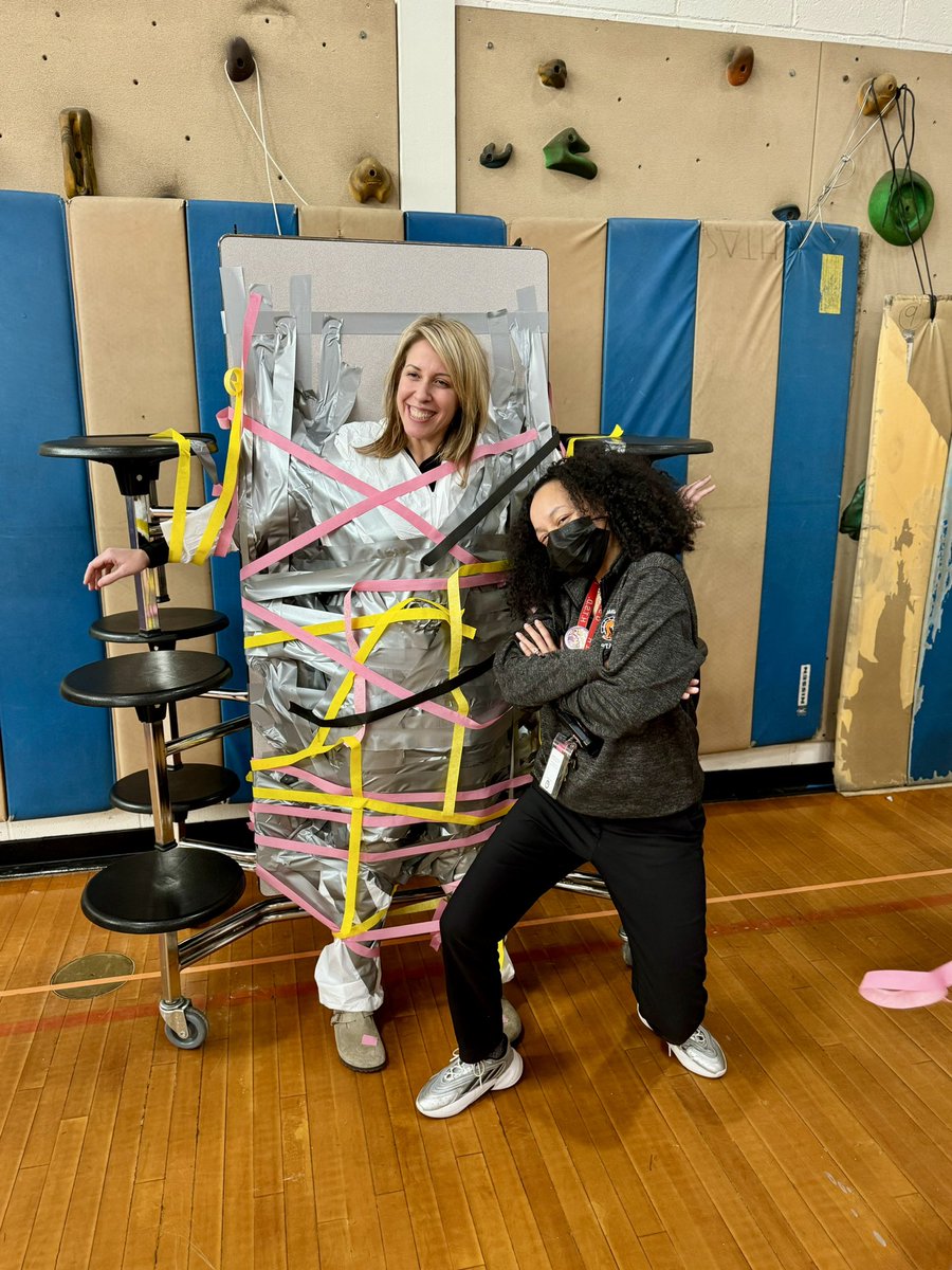 holaMsChristie's tweet photo. We ended our FriYAY taping Mrs. Piotrowski to the table during our Staff vs. Student Volleyball game! 🧡🖤 @HTSD_Grice https://t.co/lNkzXUkOoa