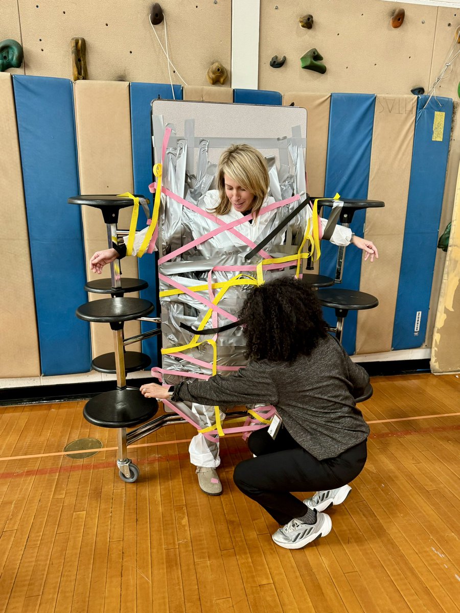 holaMsChristie's tweet photo. We ended our FriYAY taping Mrs. Piotrowski to the table during our Staff vs. Student Volleyball game! 🧡🖤 @HTSD_Grice https://t.co/lNkzXUkOoa