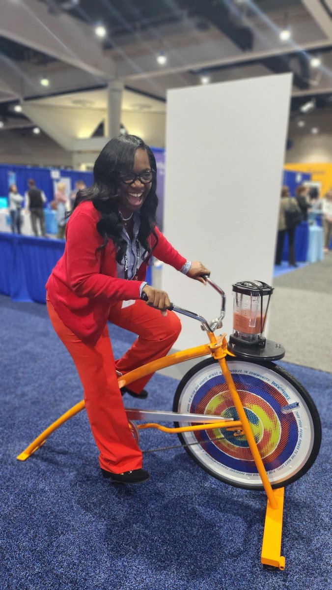 PrincipalDrH's tweet photo. Talk about #STEM !! How do you get your cardio in and make a smoothie simultaneously? With a #blenderbike ! This is the greatest creation ever! P.S....I took it back to my childhood and started to pedal, standing up! Our scholars would love this!!! #NCE2024 #Exhibithall #AASAWELL https://t.co/XmVIhpsC87
