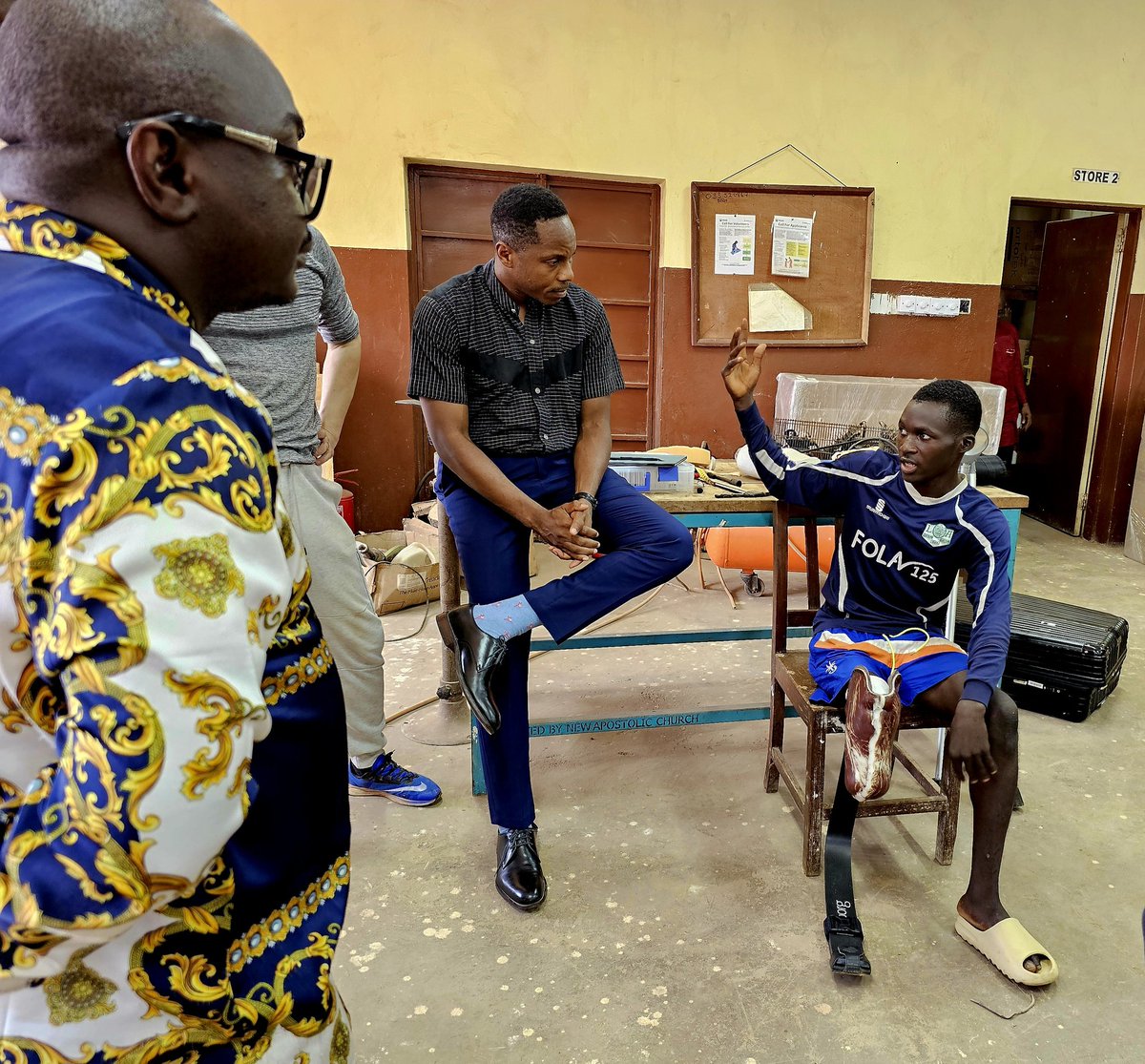 dsengeh's tweet photo. Today, we saw the first prosthetic running blade fit on a patient (an athlete) in Sierra Leone at the National Rehabilitation Center. @kenendo and I studied with @hughherr at @medialab and taught a class called developing world prosthetics which Claudine (in yellow) took. Dreams! https://t.co/FMZceKz9ej