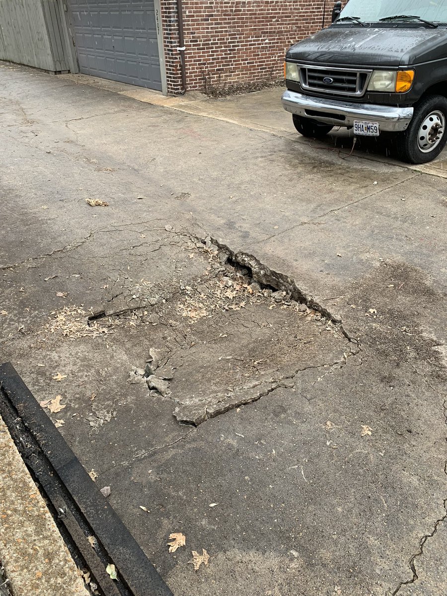 SteveConnor08's tweet photo. @CaraSpencerSTL this mini sink hole is in the alley behind 13th in between Barton and Victor in Soulard. The trash truck took five minutes to try and get out. We’ve reached out to the city but had no response https://t.co/VFyniXz92n