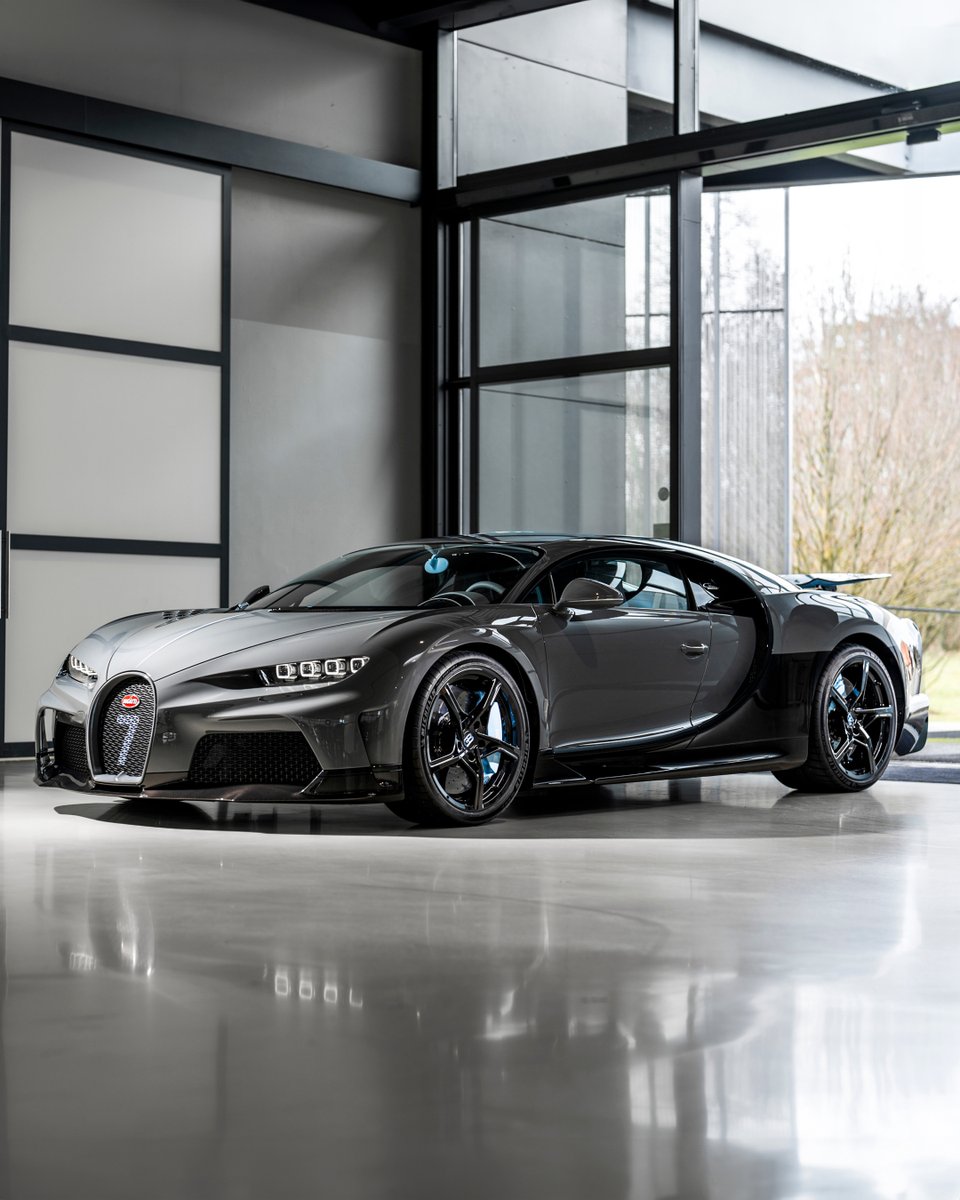 Bugatti's tweet photo. This powerful CHIRON Super Sport in 'Jet Grey' is elevated by 'Grey Carbon' and 'Lightning Blue' accents.

#BUGATTI #CHIRONSuperSport
–
WLTP: https://t.co/mCEE0ghyaw https://t.co/ecVHOemL3h