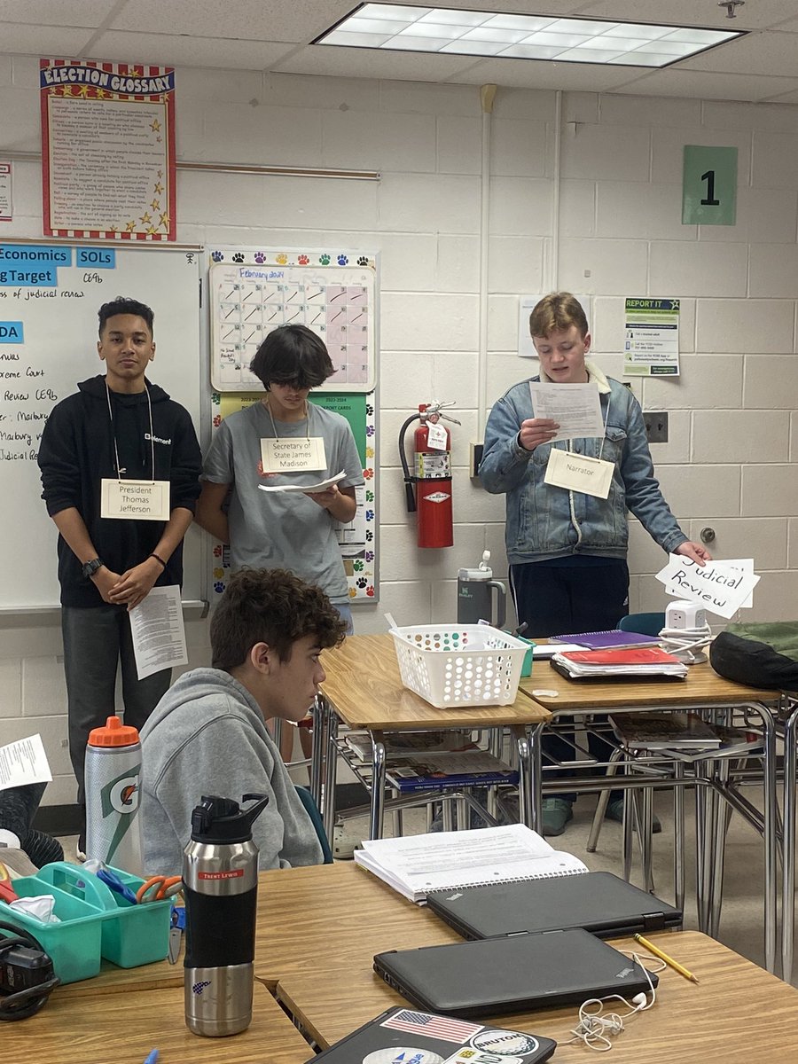 GoQLMS's tweet photo. Mrs. Givens brought history to life in Civics with a reader’s theater of Marbury v. Madison, the U.S. Supreme Court case that established judicial review in the U.S. Students participated by reading aloud from a script based on the case &amp; the decision. #PRIDEinUS #engageycsd https://t.co/DxtzgpslaG