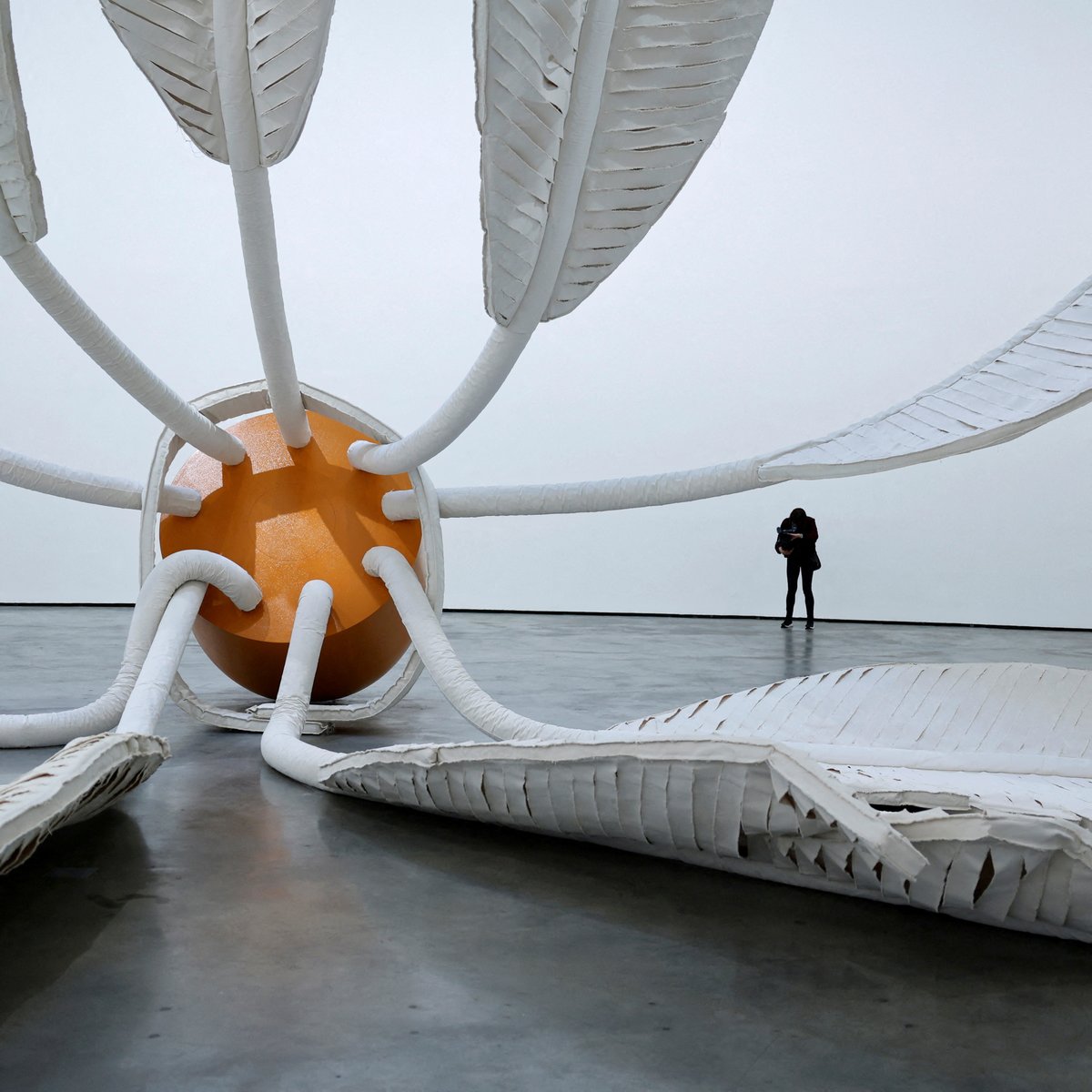 A visitor films Soft Shuttlecock (1995), by Claes Oldenburg and Coosje Van Bruggen during the preview of Signs And Objects. Pop Art From The Guggenheim Collection, Bilbao, Spain, February 15, 2024. REUTERS/Vincent West