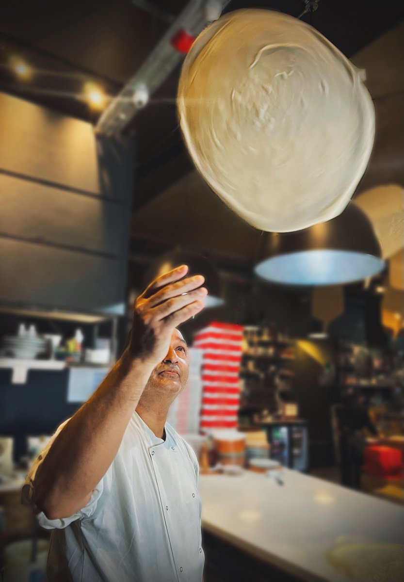 "Capturing the magic as our skilled chef effortlessly rolls and tosses dough, turning it into a canvas for the perfect pizza masterpiece. 🍕✨ #PizzaArtistry #ChefSkills #Reels #Pizza #fyp