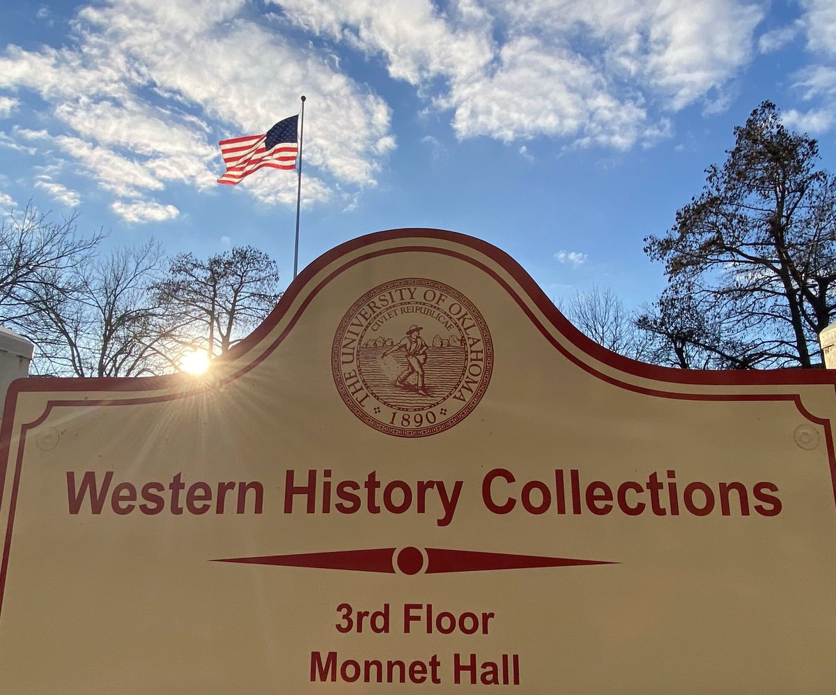 PalmeriJoAnn's tweet photo. View of setting #sun behind Western History Collections sign outside Monnet Hall on north oval @UofOklahoma #OUskywatch #OULibraries #BlueSkies #LibrariesFromTheOutside https://t.co/XnfCg2TUxr