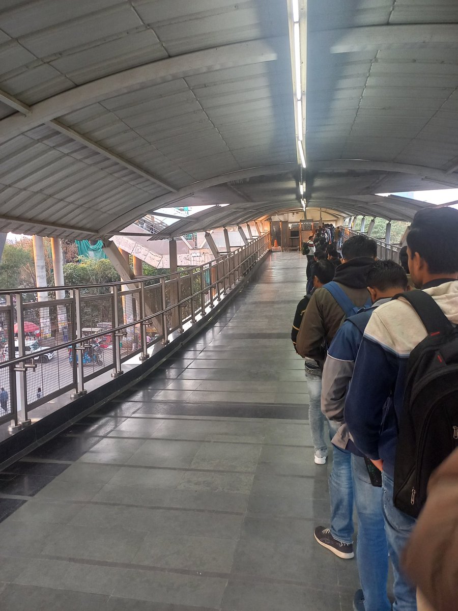 anand_501's tweet photo. @OfficialDMRC @RapidMetro 

Who decides the function of only one security gate, even at peak time. Been like this for more than a week! https://t.co/lKIxbtbN7S