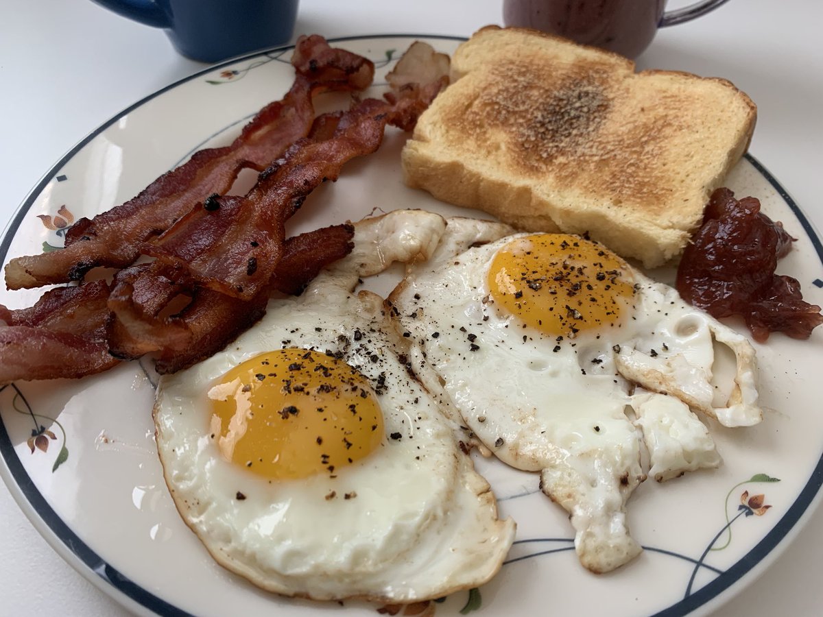 Introducing A Delicious Crispy Bacon Delight! Crispy bacon, sunny-side-up eggs, jelly, and brioche toast paired with a refreshing smoothie and a hot cup of coffee. 🥓🍳🍞☕️  What’s on your breakfast menu today? 

#BreakfastDelight