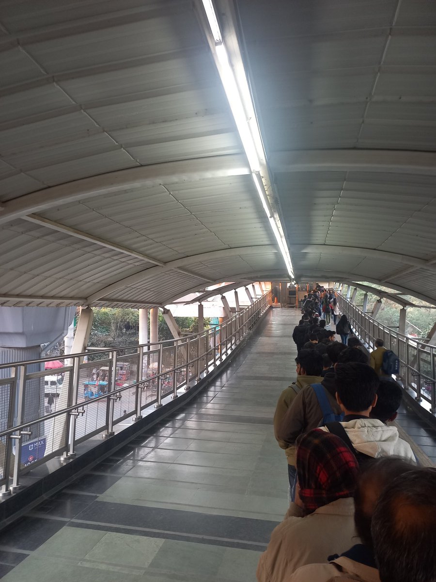 anand_501's tweet photo. @OfficialDMRC @RapidMetro 

Who decides the function of only one security gate, even at peak time. Been like this for more than a week! https://t.co/lKIxbtbN7S