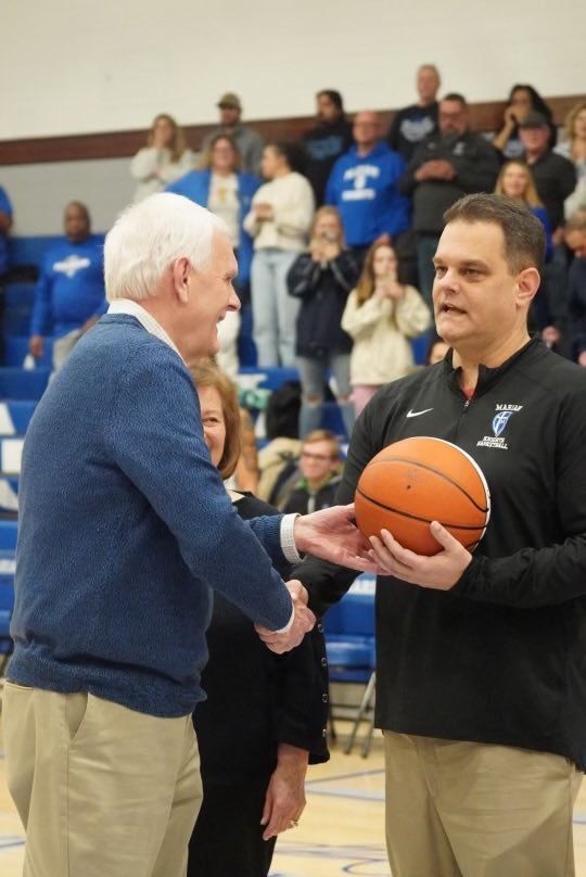 Congratulations to Coach Robb Berger on his 400 career win and 300th win at Marian.  It’s a proud moment for his dad Bob who presented him the ball. #GoKnights.