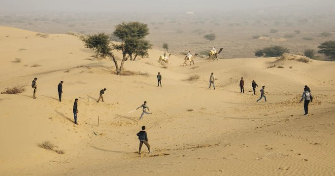 PictureSporting's tweet photo. Steve Waugh’s picture of children playing cricket among sand dunes near Osian in India was named Wisden's Cricket Photograph of the Year for 2021 https://t.co/goimzwo8Ds