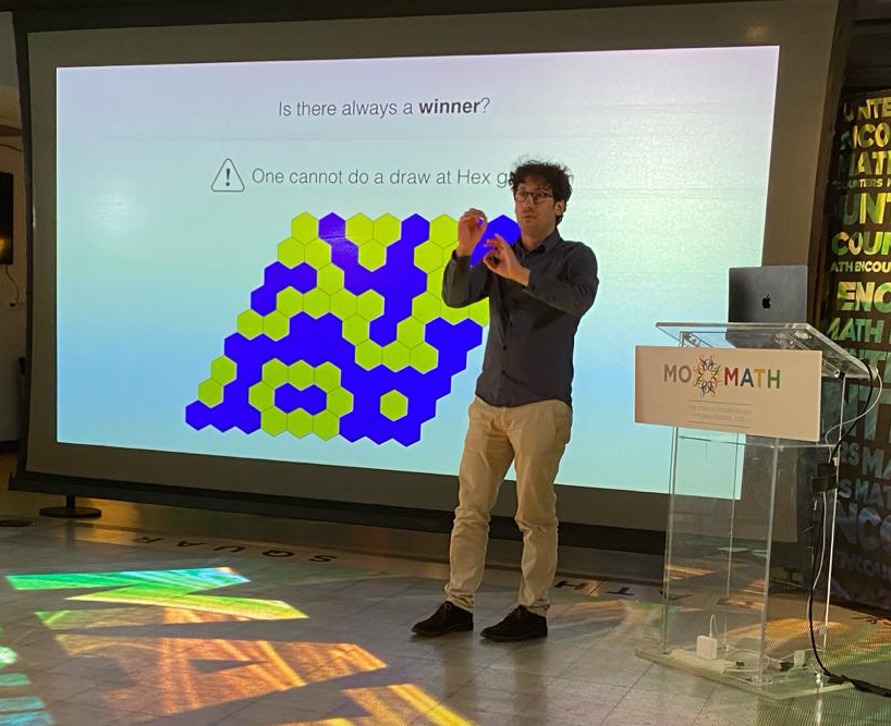 On Wednesday, Feb 14th, Hugo Duminil-Copin, Permanent Professor at IHES <a href="/UnivParisSaclay/">Université Paris-Saclay</a> and <a href="/UNIGEnews/">Université de Genève</a> gave a talk on the mathematical underpinnings of the game of HEX at <a href="/MoMath1/">National Museum of Mathematics</a> in New-York.