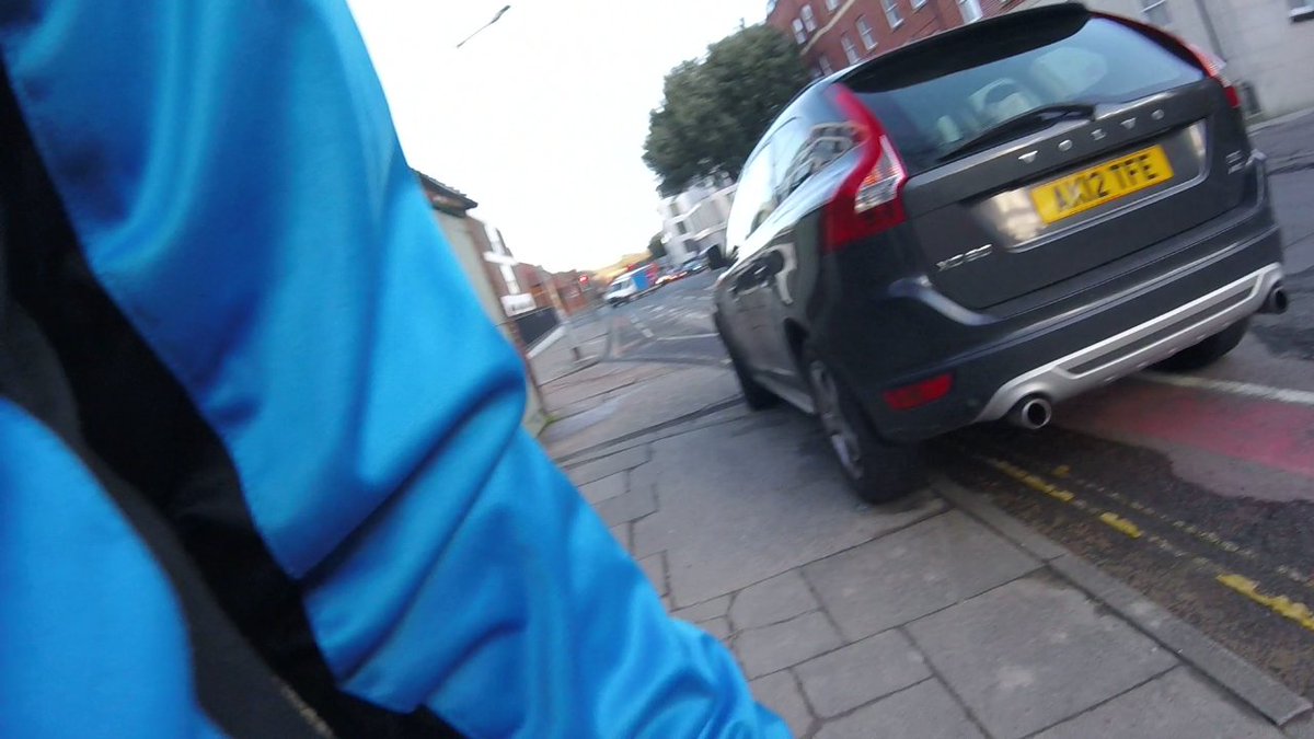 AK12TFE, saw this guy ignore road closed signs at traffic lights, turned across into a firm's parking (nearly wiped out cyclist - not me) b4 reversing back out - parked here (across cycle path, double yellows and pavement) then walked a couple of hundred yards into pharmacy