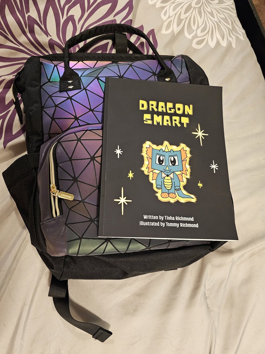 Packing for #IDEAcon! I had to sneak out #DragonSmart from my son's room so I can get it signed by @tishrich and her son!