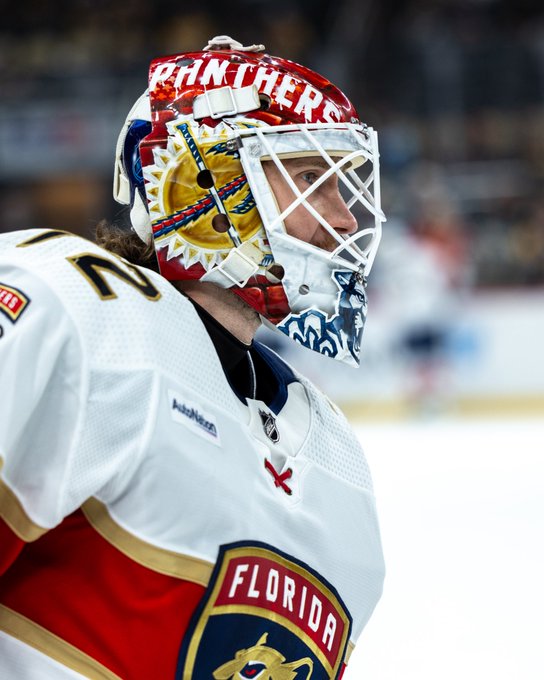 Panthers goaltender Sergei Bobrovsky on the ice in his white road uniform and goalie gear.