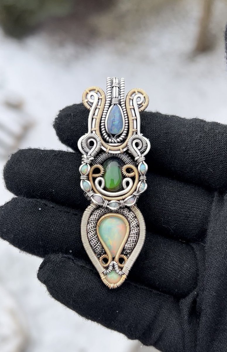 cosmic_coils's tweet photo. Just finished up this Opal spaceship! 11 opals in here 🤩. Wrapped in sterling silver and 14k gold filled wire. The camera does not do these opals justice 😫 https://t.co/8rcPssbm4y