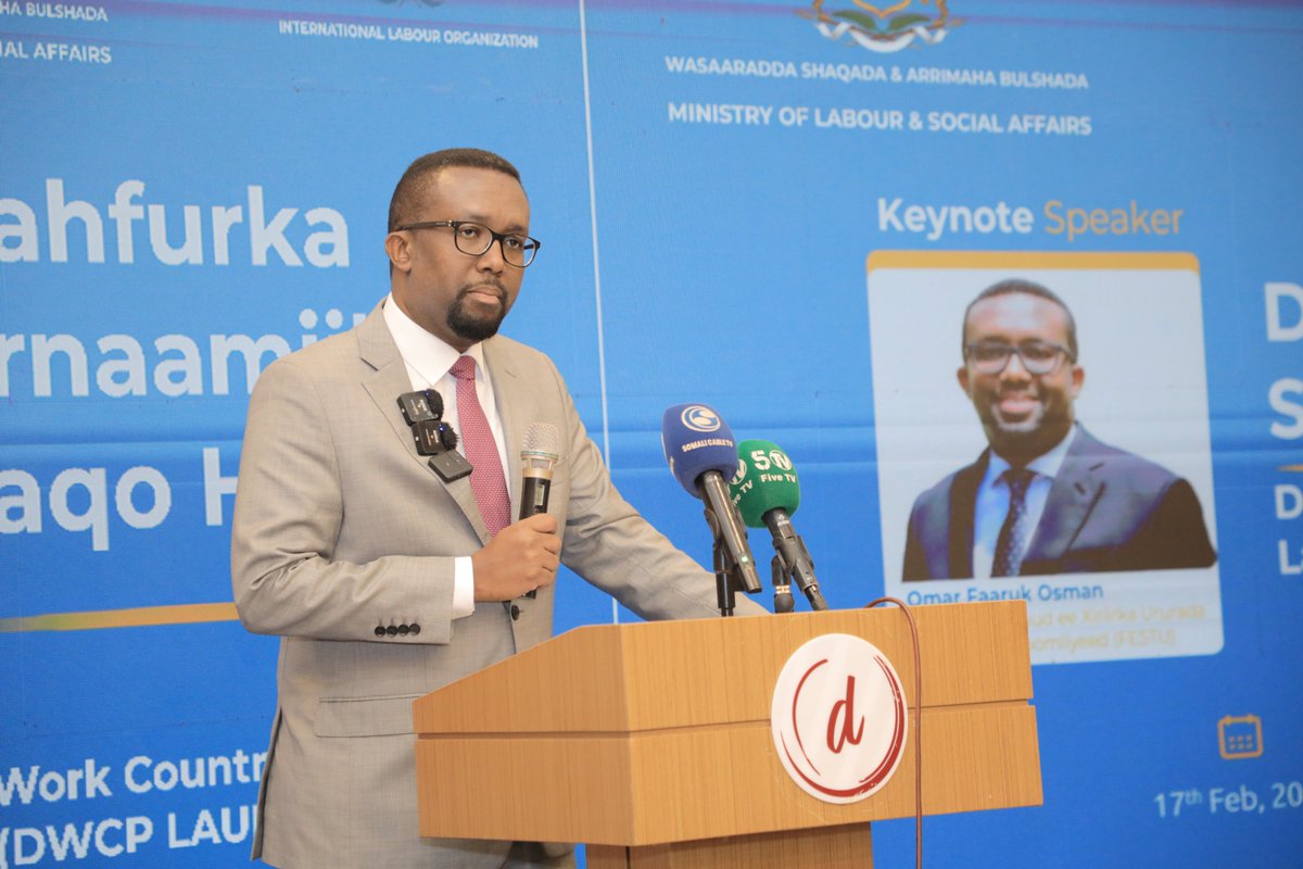 festusomalia's tweet photo. It's official! Today, Somalia marked the official launch of its #DecentWork Country Programme (#DWCP) with a well-attended event in Mogadishu. The occasion was graced by the presence of the Acting President of #Somalia and the Speaker of the House of People @AadanMadobe.
In a tripartite partnership involving the Ministry of Labour and Social Affairs, the Federation of Somali Trade Unions and the Somali Chamber of Commerce and Industry, with crucial support from the International Labour Organization (@ILO), the DWCP, signed by the tripartite constituents and the ILO on 10 June 2023, is geared towards tackling the particular challenges Somalia encounters in guaranteeing decent work for all.
Decent work holds immense benefits for Somalia's working people and economy. It means providing opportunities for meaningful employment, fair wages and social protection. It also involves fostering dialogue between #workers, #employers and the #government to ensure that everyone's voice is heard and respected in the workplace.
In Somalia, where issues like unemployment, underemployment and informal work are prevalent, the DWCP seeks to make a real difference. By promoting decent work, it aims to create a more stable and prosperous society, where Somali people have the opportunity to build better lives for themselves and their families.
Furthermore, the DWCP aligns with Somalia's broader national development goals, contributing to poverty reduction, social cohesion and sustainable economic growth. By investing in decent work, Somalia is investing in its future, laying the foundation for a more inclusive and resilient society.