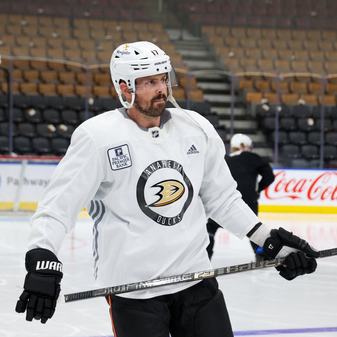 Alex Killorn skating in a white practice jersey. 