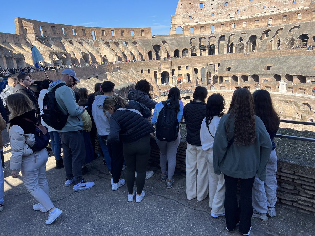 CoachTurkOHS's tweet photo. Day 2 - can’t wait to edit this guy out of the group photo. Thanks green shirt. Amazing food and gelato keep us going. Can the cafeteria start serving gelato? I think it would sell pretty well. @OSchoolsPR @TeachMitch @DianeProvvido https://t.co/La6iHPT7Al