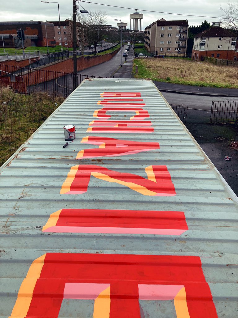 This mornings view before the weather broke. 1m high letters along 12 meters of shipping container roof - to be viewed from the passing double deckers - hand drawn and painted over a few busy hours. #alwayshandpaint