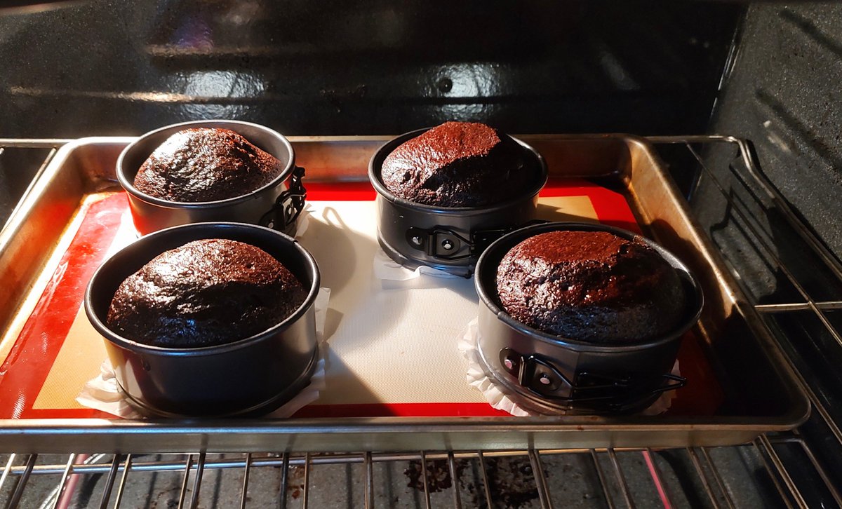 Mini chocolate cakes. I'd seen recipes which use boiling water but had never tried making one, so I figured I'd give it a shot today. They look and feel really moist, so I'm anxious to try it and see. Not the most symmetrical cakes I've ever made, but hopefully they taste good!