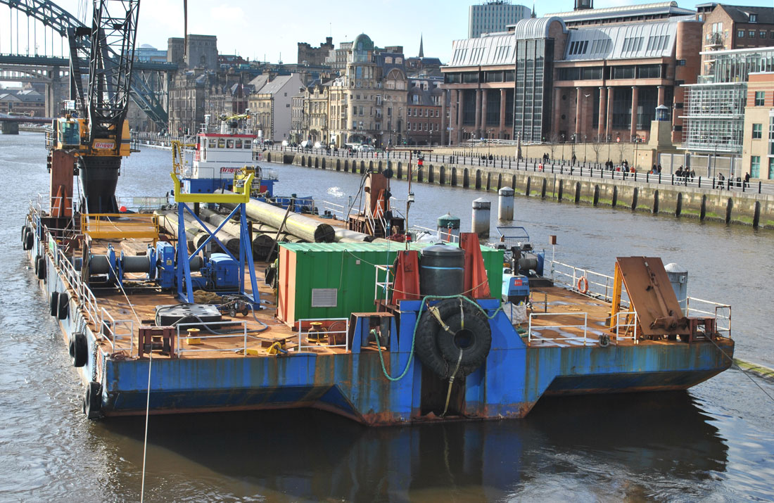 TyneSnapper's tweet photo. #Newcastle #Gatehead Removal of the bollards at the Gateshead Millennium Bridge on this day 18th February 2012. https://t.co/2TuA21G4Y0