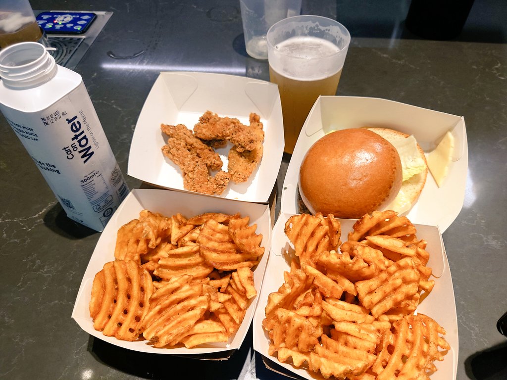 BounceGo's tweet photo. @FootyScran Southern Fried Chicken and a Cheese Burger, both with Waffle Fries, a bottle of water and a pint. £28 at Tottenham Hotspur Stadium. https://t.co/LXUlnpM7YA