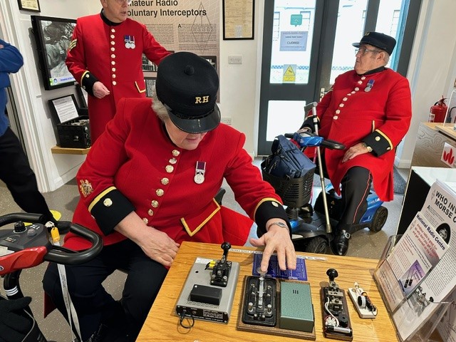 theRSGB's tweet photo. Volunteers at the RSGB National Radio Centre were delighted to welcome a group of @RHChelsea from the Royal Chelsea Hospital. Some had previously worked at @Bletchleypark and were pleased to try their hand at #Morse code &amp; see GB3RS in operation. 
#amateurradio #hamr https://t.co/GDPBtDAP1C