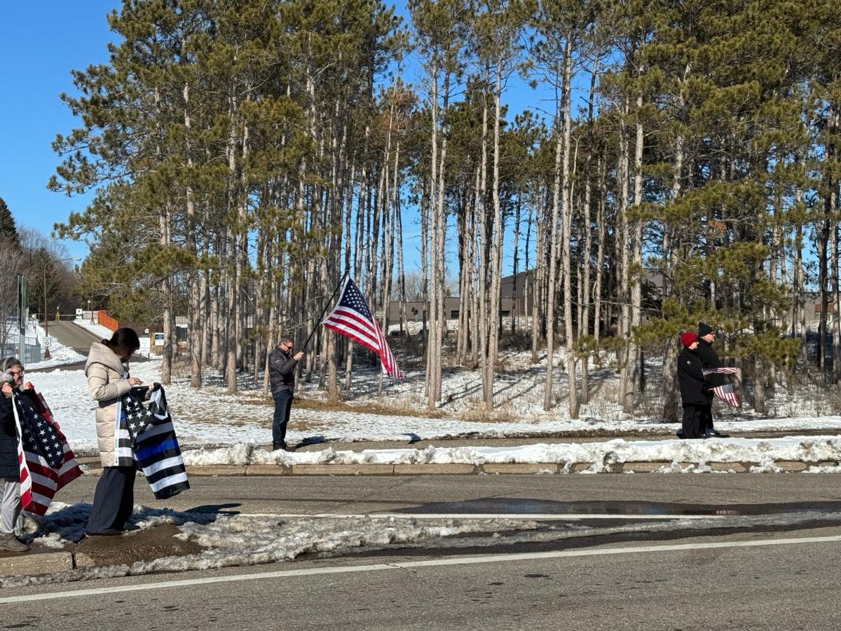 PHOTOS: Police and residents greet a law enforcement procession accompanying 2 fallen Burnsville police officers and a fire medic who were shot and killed Sunday morning. (Photos by @KevinRofidal )