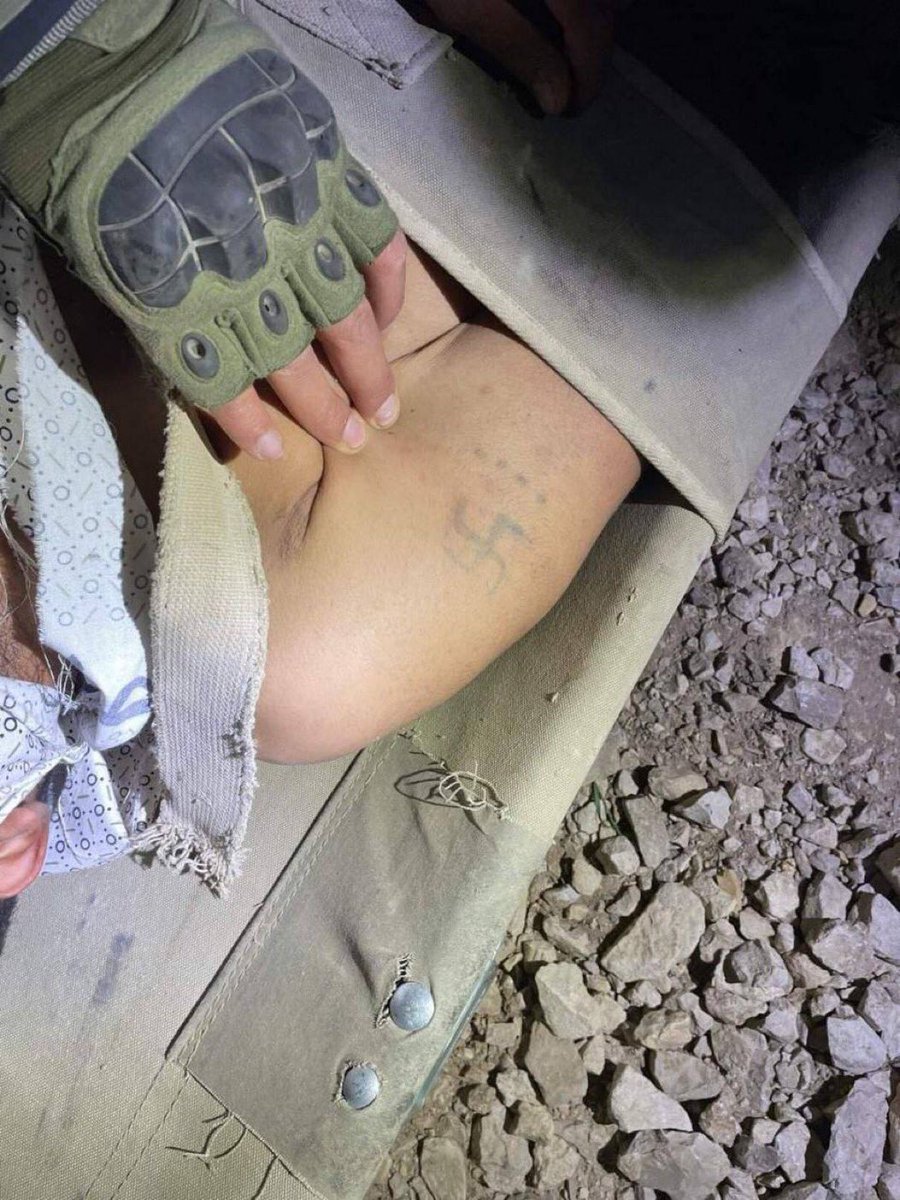Israeli forces find a Nazi Hakenkreuz tattoo on the arm of a Hamas terrorist that they just liquidated