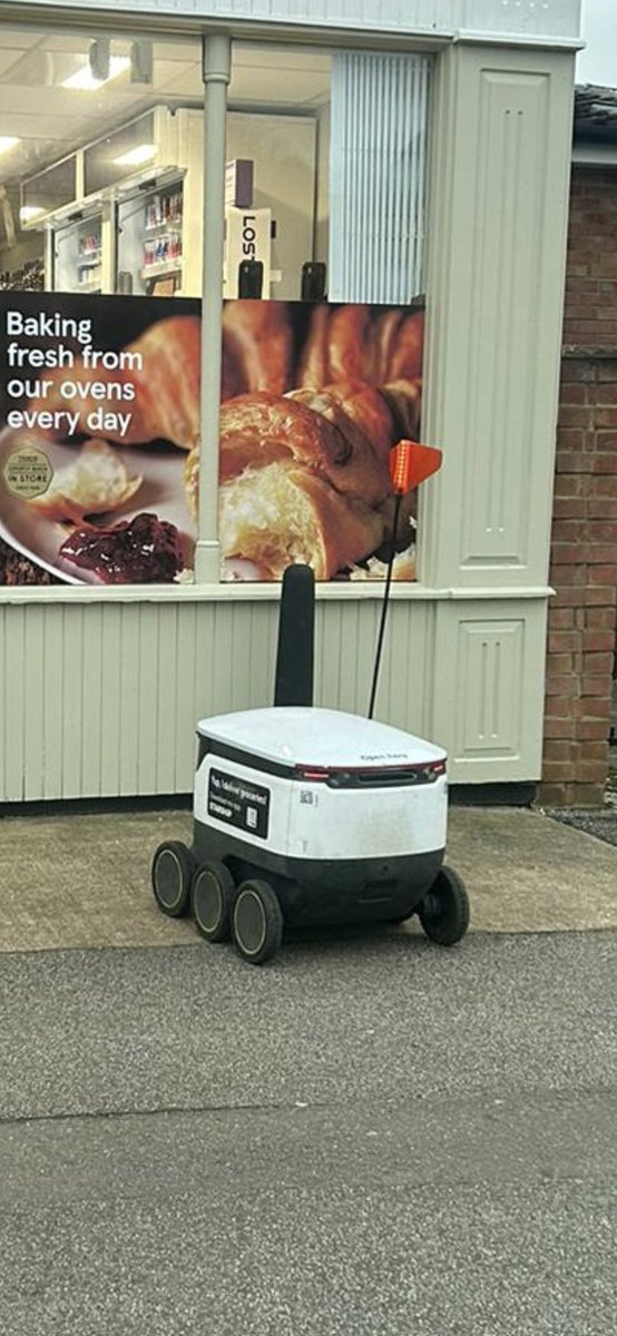 Driving back from Arsenal on Saturday...stopped of at a quaint little village of the motorway for fuel....didnt expect to see these automated robots delivering food to people's house