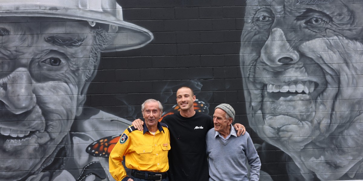 NSWRFS's tweet photo. The Hill Top Brigade unveiled a special mural on Friday. Spread across an entire wall of Hill Top station, the painting features long-serving volunteers Brian Coates and John Matters. Between the two of them, Brian and John have dedicated some 150 years to the RFS. https://t.co/tto5fQeyzH
