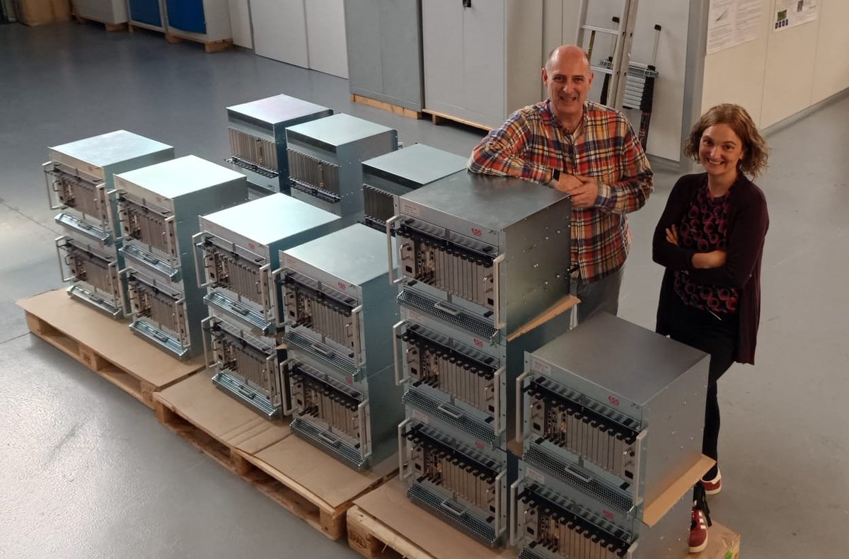 RF team of @BilbaoEss, Pedro González and Nagore Garmendia proudly posing next to 21 MicroTCA.4 Low Level RF (LLRF) crates for the high beta section of the @essneutron proton linac. With this delivery, @BilbaoEss completes a significant in-kind contribution.