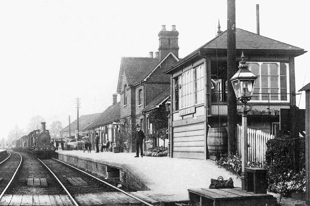 Alcester Station c.1910

A Midland Railway goods train is seen passing through the station on a Birmingham to Evesham freight service.

The oil lit lamppost located on top of the timber platform is to assist the exchange of the single line baton between the signalman and the…