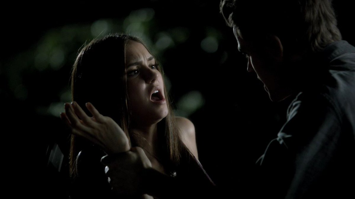 Stefan holds Elena's arm and squeezes it for her to release the syringe and pushes her, considering he could have easily taken it out of Elena's hand without being rude to her.