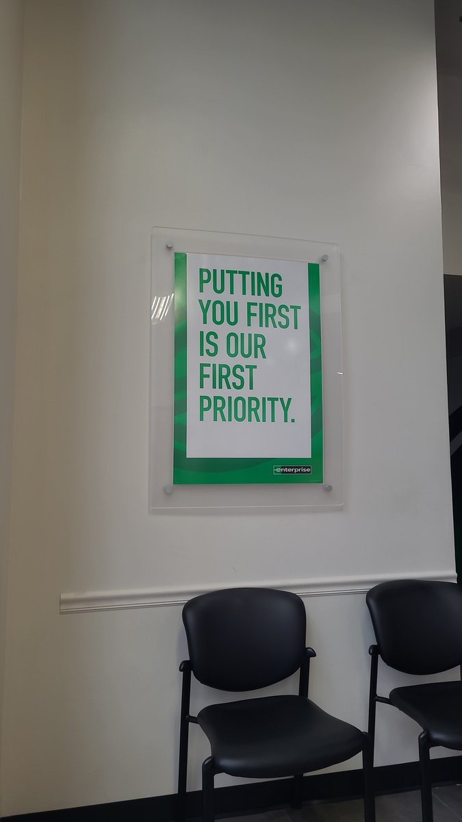 How can <a href="/enterprisecares/">EnterpriseRentACar</a> hang this on the wall when it's a farce? They are more concerned about eating breakfast and socializing to begin with. 50+ vehicles in the lot. Waiting 25 min so far. "They need to clean a car first." Rental time is in reservation. #WTF