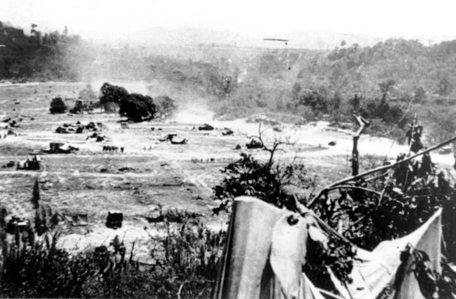 OTD 19 Feb 1944 at the Admin Box. Unconfirmed reports of Japanese troops retreating west to east across Kalapanzin River. Large quantities of rum lost from failing parachutes. Box a shambles;trees bare,paddy a torn up dusty mess,&burnt out vehicles. Flies becoming a real problem.