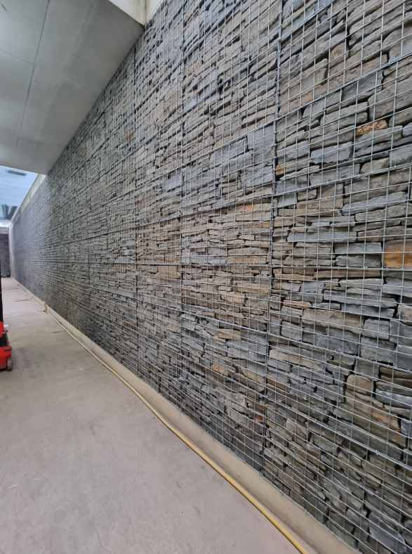 In 2022 Maccaferri Construction completed the successful installation of 166m2 Welded Gabion cladding to a reinforced concrete retaining wall to form a light well for a staff recreation area in a high-spec HQ building! 💼 #WeldedGabionCladding 👉tinyurl.com/mv6aduze