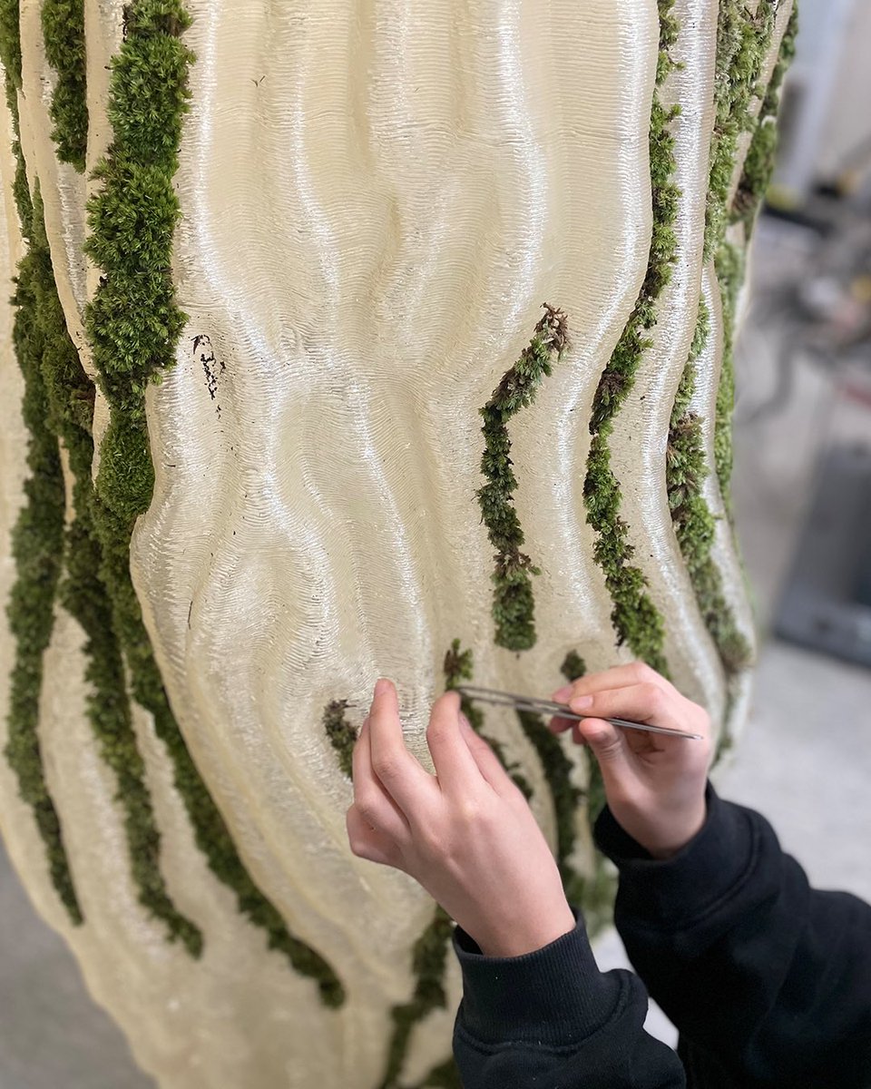 parametricarch's tweet photo. Moss Column, designed by Yong Ju Lee, is a prototype that merges living organisms with architecture. It aims to update the approach of blending natural life with manmade structures. Mosses are embedded into artificial materials using advanced construction technologies.

The design algorithm creates a subtle pattern that blends natural and artificial elements, mimicking the organic dissolution process. This attempt provides a radical solution for integrating organic and inorganic matter through a single-body geometric system. It highlights the interaction and exchange of respiratory and photosynthetic byproducts between people and nature.

🔗 Tap the link to read more about the project: https://t.co/hRuQysyyIQ

#parametricarchitecture #yongjuleearch #3dprintingarchitecture #digitalfabrication #yongjuleearchitecture