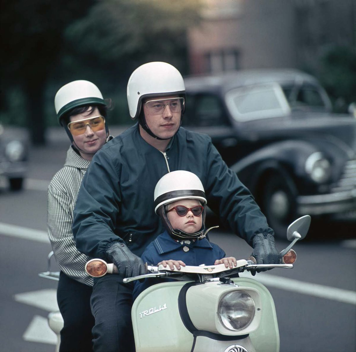 Family rides the “Troll” scooter, GDR, 1964