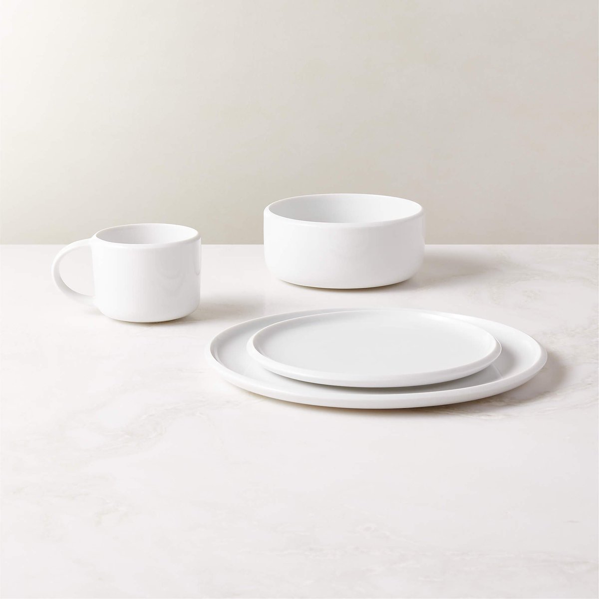usgraphics's tweet photo. Dinner/Drinkware design has several features that go unnoticed, but are glaringly obvious when they are missing. 🧵(1/2)

Take for e.g. these modern dinnerware sets. They are everywhere. What's the problem with these?

1) Flat plates struggle to contain foods with gravy/sauce, causing messes with the slightest movement. 

2) The absense of bottom rim means dirt from countertops can easily transfer to the flat bottom. A tiny drop of sauce smears across a large flat bottom. And you'll be stamping that dab of sauce everywhere with your plate. This escalates fast as other plates then pick up the sauce.

3) Lack of a thumb rest around the edge of the plate complicates handling. Handle it from the top rim and you've just created a fulcrum at the edge of the plate (Unstable). Your thumb will most likely land inside the serving area as you struggle, overrun by sauces sloshing around on a flat surface.

4) Handling is further undermined as you try to pick up the plates. There is no overhang for your fingers to slide under.
