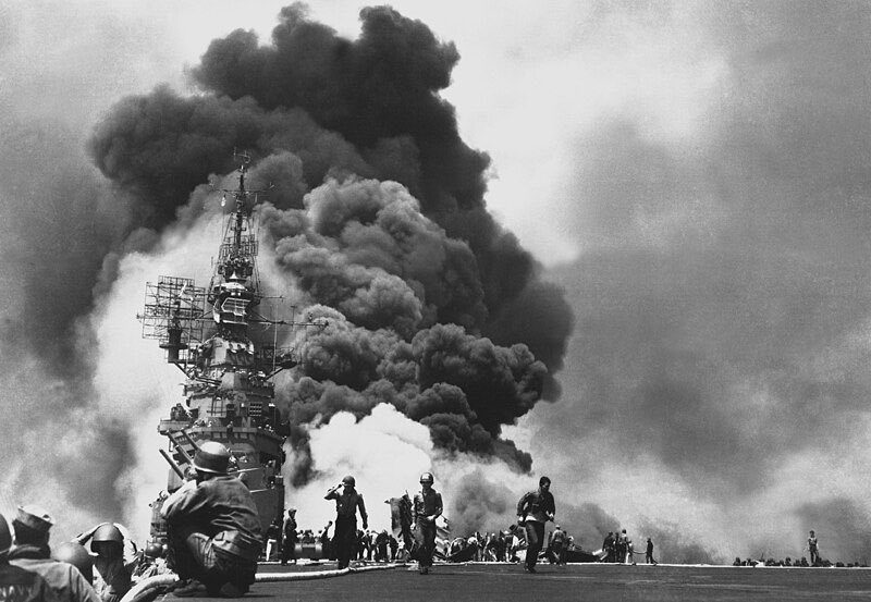 American aircraft carrier USS Bunker Hill burns after being hit by two kamikaze planes within 30 seconds.

Image ©️ U.S. Navy; The original uploader was Quercusrobur