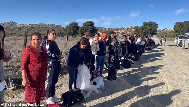 TonySeruga's tweet photo. Dozens of illegal Chinese migrants are rounded up in California border town along with Syrians and Turks - and tell the cameras: 'We're here to take the money'

Shocking images and video taken in California this weekend show Chinese migrants lined up at the border town of Jacumba and telling reporters shamelessly how they're here to 'take the money'. 
Dozens and dozens, possibly up to hundreds of migrants, crossed the international boundary, according to Griff Jenkins of Fox News, who recorded the footage.

'This is one of the largest groups of Chinese I have ever come across and there were two groups at the same time crossing in Jacumba, CA,' the correspondent tweeted last week.

https://t.co/RqIkpkrp5C
